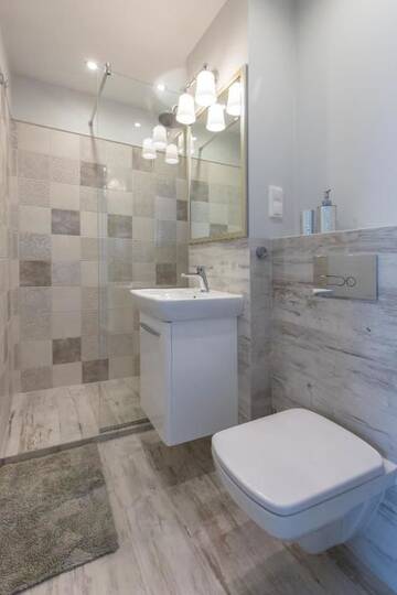 Фото номера Апартаменты Делюкс с балконом Апартаменты Apartament Świętokrzyska г. Варшава 24