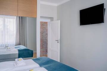 Фото номера Апартаменты с 2 спальнями Апартаменты APARTEL Plac Unii Lubelskiej г. Варшава 31