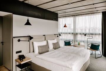 Фото номера Двухместный номер с 2 отдельными кроватями Отель Vienna House Mokotow Warsaw г. Варшава 6